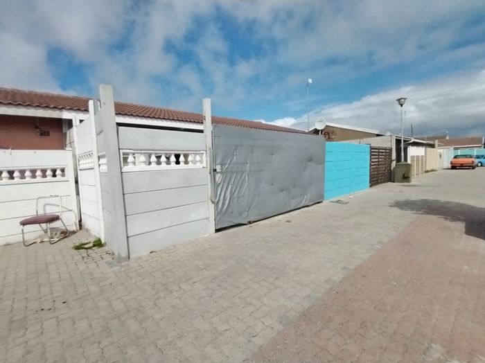 Two-bedroom house for sale in Pelican Park with open-plan living and spacious yard.