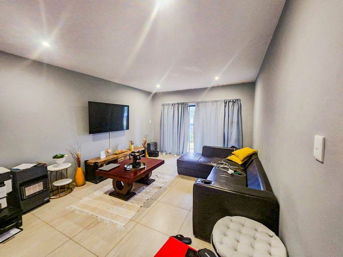 Apartment For Sale in Hilton Central: 2 Bedrooms, covered patio, communal pool, security.