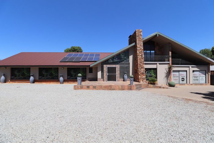 Commercial office space to rent in Wilkoppies with shared amenities and parking.