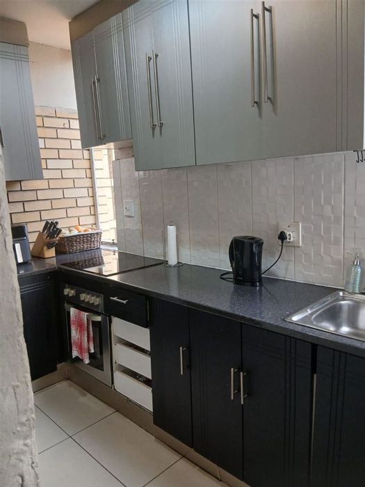 For Sale: Apartment in Kempton Park Central with garden, secure complex, close to amenities.