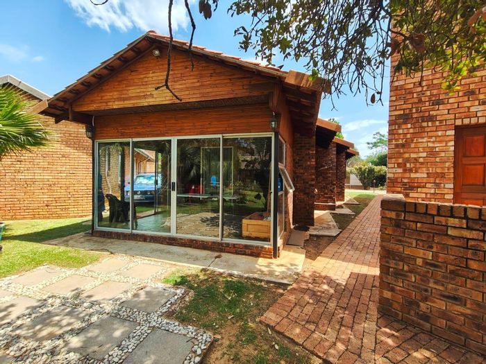 For Sale: Townhouse in Vaal Marina Central with pool, barroom, and waterfront views.