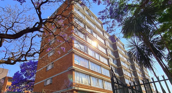 Commercial property for sale in Sunnyside: 63 apartments, ample parking, and garden space.