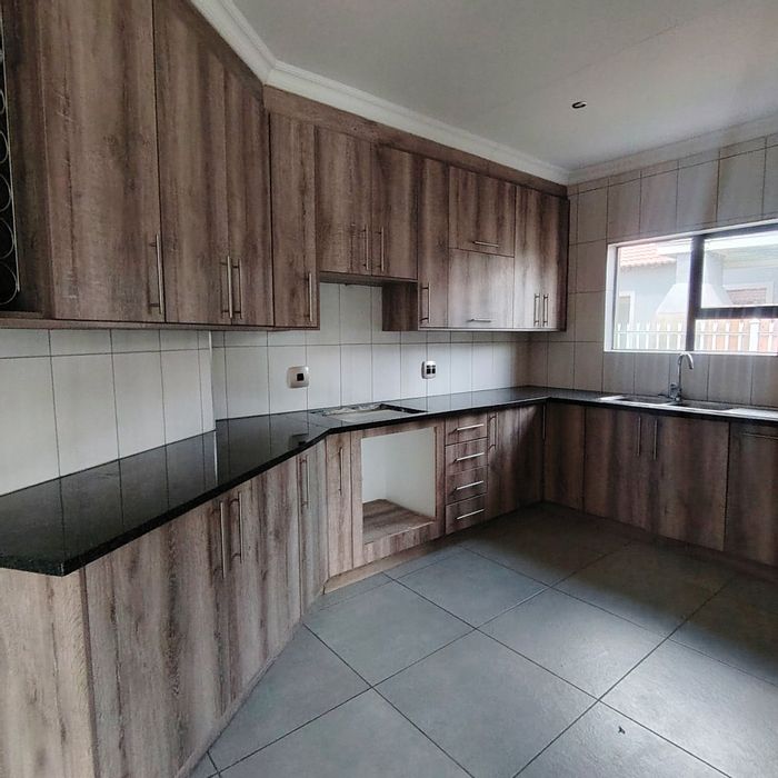 For Sale: House in Mandela View with 4 bedrooms, garden, and security features.