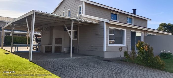 For Sale: 2-Bedroom House in Hartenbos Central with pool, secure complex, and carport.