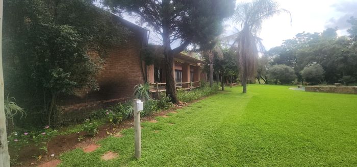 Farm for Sale in Brits Central: Riverfront, spacious home, livestock potential, security features.