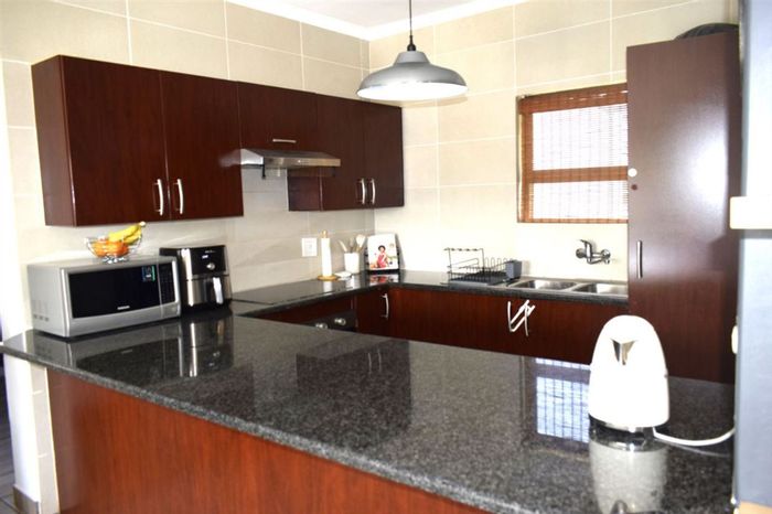 For Sale: 3-Bedroom Townhouse in Jansenpark with pool, scullery, and carports.