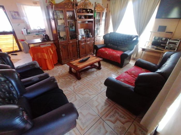 Spacious 4-bedroom house in Scottsdene with outdoor braai and ample parking. For Sale.