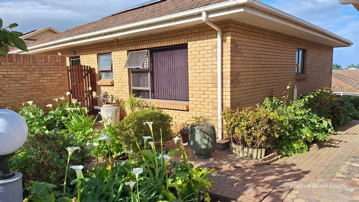 For Sale: Hartenbos Central Townhouse with private garden, solar panels, and double garage.