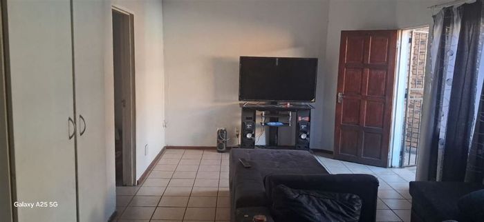 For Sale: Apartment in Kempton Park Central with 2 bedrooms, garage, and family spaces.