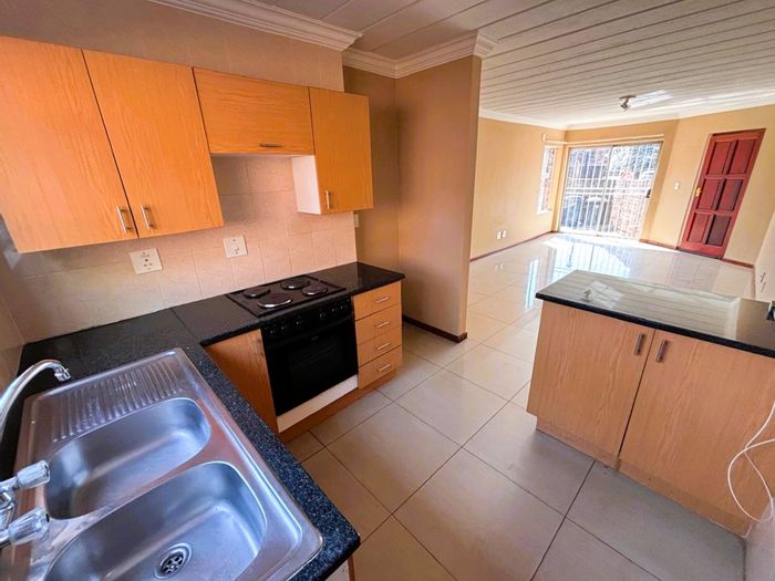 Highveld Townhouse For Sale: Renovated unit with garden, double garage, and en-suite.