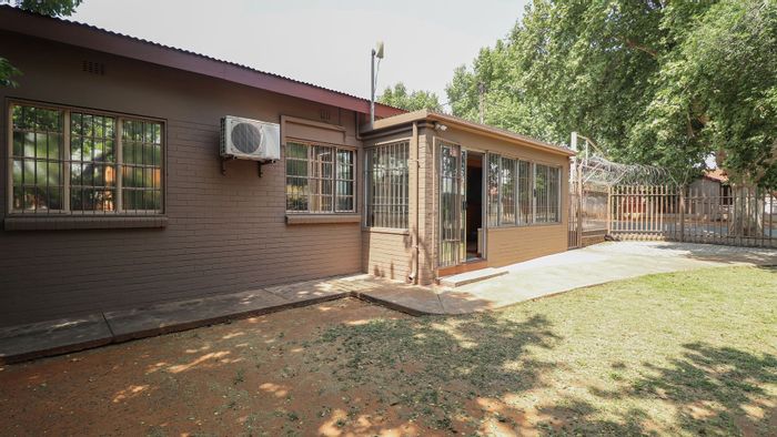 Commercial property for sale in Pienaarsdorp: two buildings, inverter system, security features.
