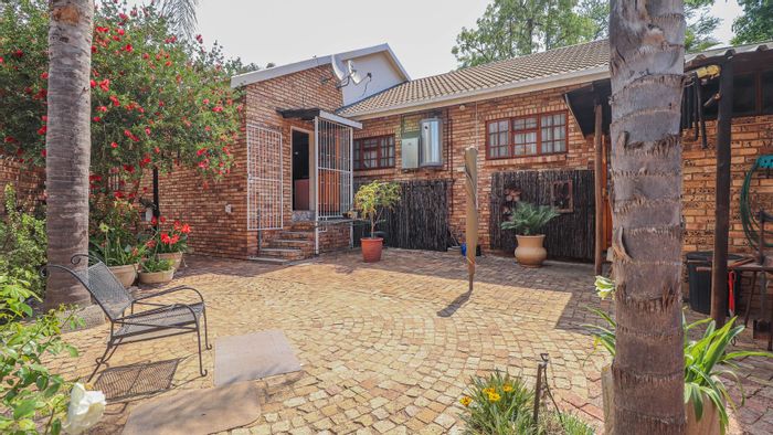Spacious Wilkoppies townhouse for sale with security, garden, and entertainment room.
