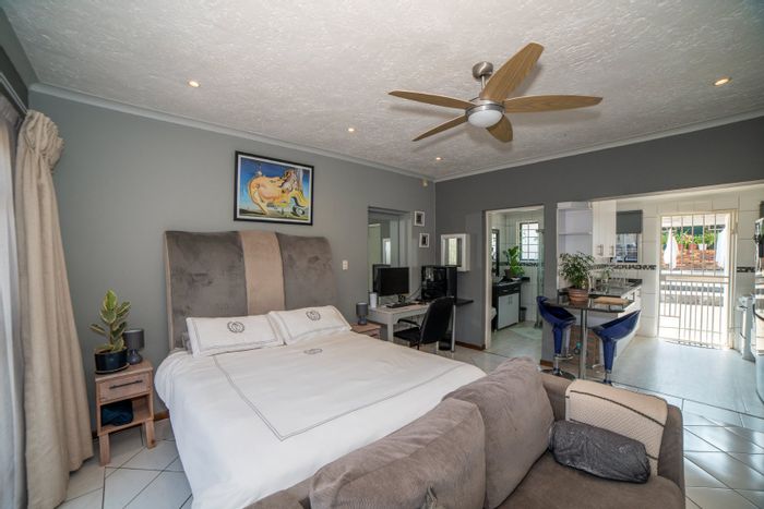 Fully furnished bachelor apartment in Randburg Central, includes utilities and pool access.