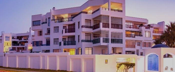 For Sale: Summerstrand Apartment with 3 Bedrooms, Double Garages, and Beach Access.