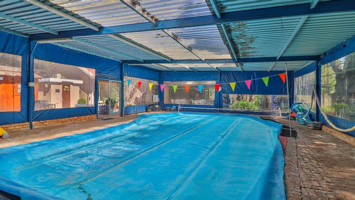 For Sale: Bedfordview Central House with 2 cottages, pool, and ample parking.