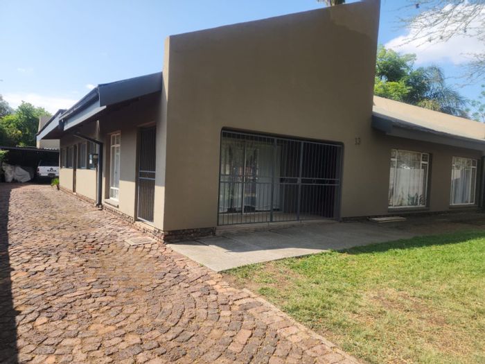 For Sale: House in Brits Central with 5 bedrooms, 2 flatlets, and rental income.