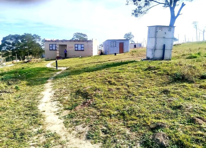 2-Bedroom House For Sale in Mbekweni with spacious dining, kitchen, and fenced yard.