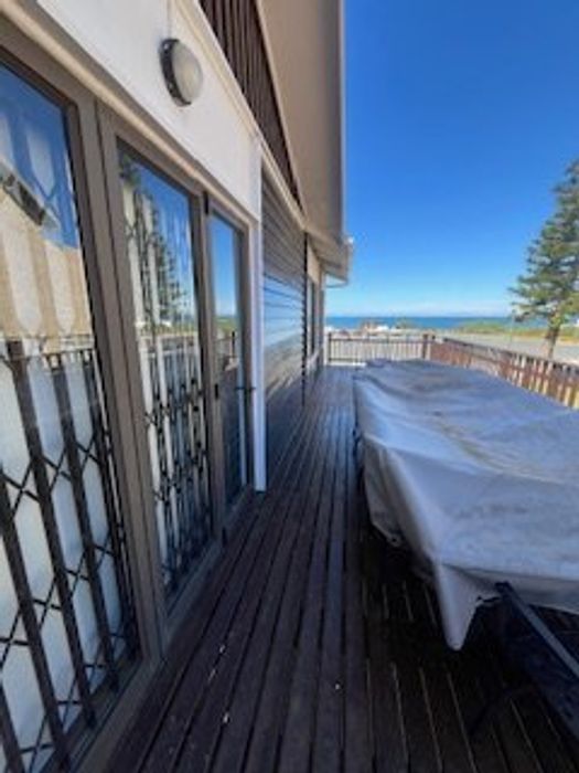 House To Rent in Outeniqua Strand: 4 bedrooms, ocean views, office space, outdoor deck.