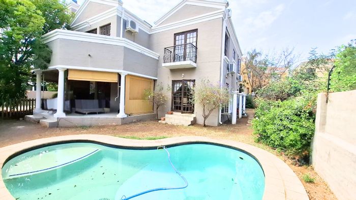 For Sale: Spacious Kyalami Hills house with pool, double garage, and clubhouse access.