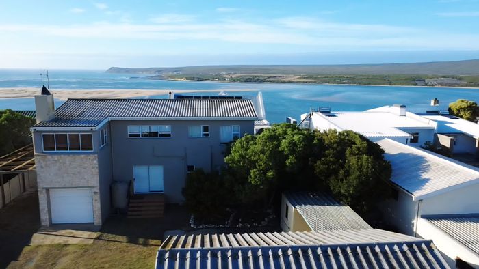 Witsand Central House For Sale: Spacious with sea views, garage, and versatile layout.