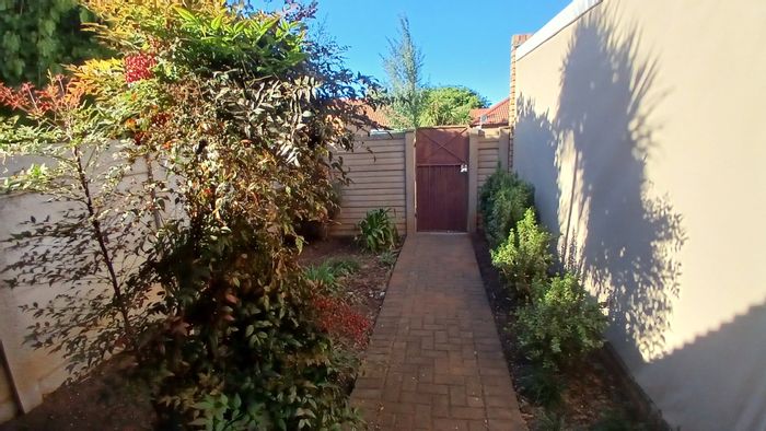 For Sale: Langenhovenpark Townhouse with 2 beds, double garage, and rental income.