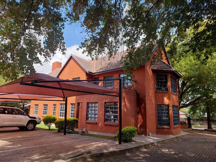 Bryanston Commercial Property For Sale: Office building with 22 parking bays, security.