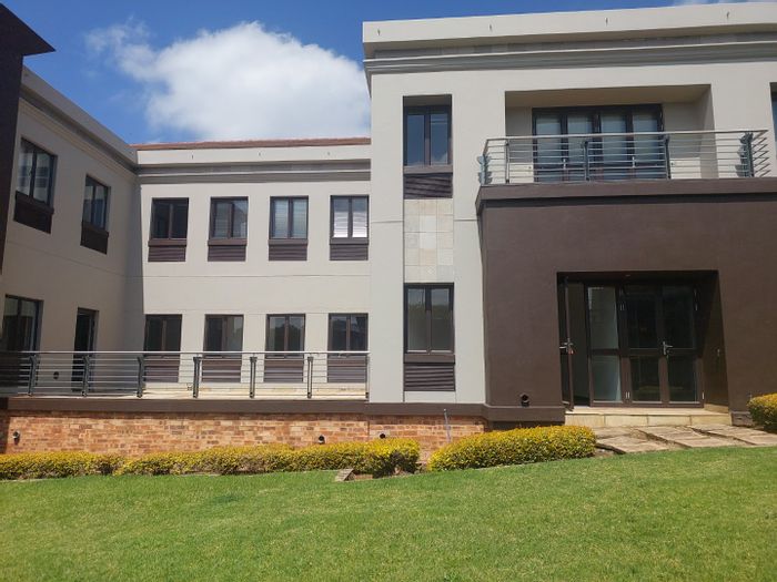 Ground floor commercial office in Bryanston with private patio and ample amenities.