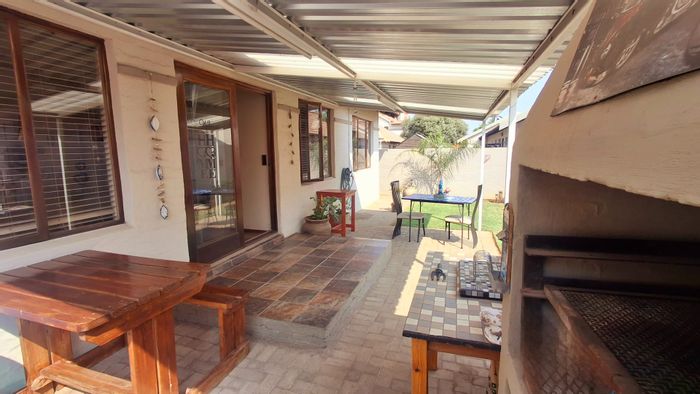 Vaalpark Townhouse For Sale: 2 Bedrooms, private garden, secure complex, ideal for families.