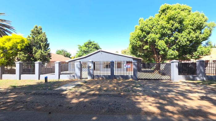 For Sale: Spacious 4-Bedroom House in Stilfontein Ext 4 with Garden and Security.