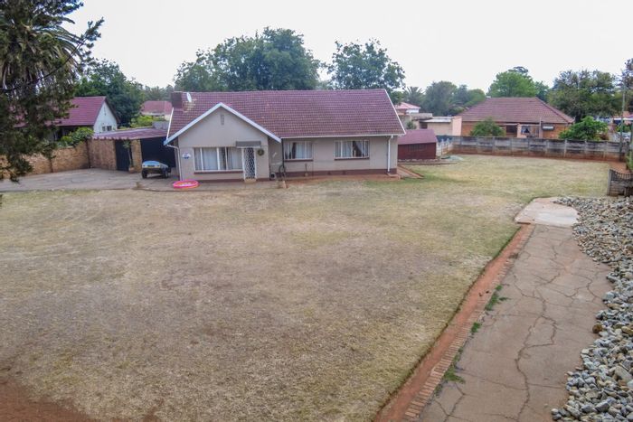 3-Bedroom House in Stilfontein Central For Sale with spacious yard and built-in braai.