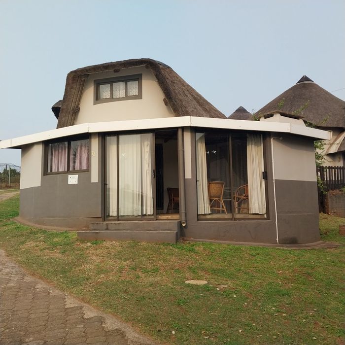 House for Sale in Hibberdene Central: Secure complex, pool, beach access, versatile loft.