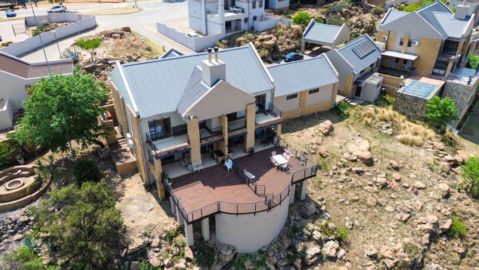 For Sale: House in Aquavista Mountain Estate with dam views, double garage, and security.