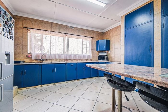 Spacious 3-bedroom house in Birchleigh with large carport and versatile living spaces. For Sale.