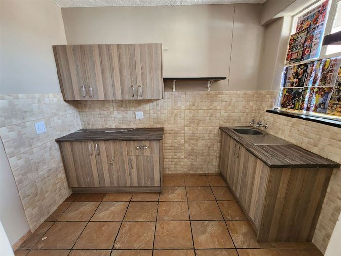 1-Bedroom Apartment For Sale in Kempton Park Central with secure parking and amenities.