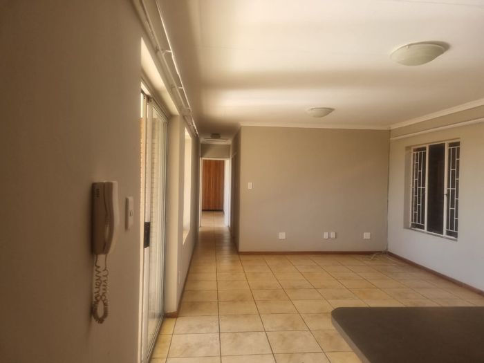 Spacious 3-bedroom apartment with garage, patio, and ample storage in Waterberry Country Estate.