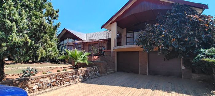 For Sale: House in Manzil Park with 4 bedrooms, gym room, and large yard.