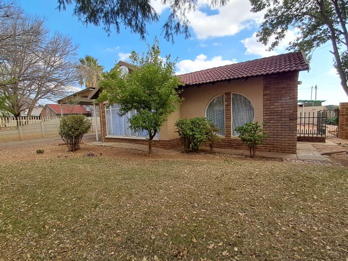For Sale: Two houses in Meiringspark with rental income, pool, and carport.