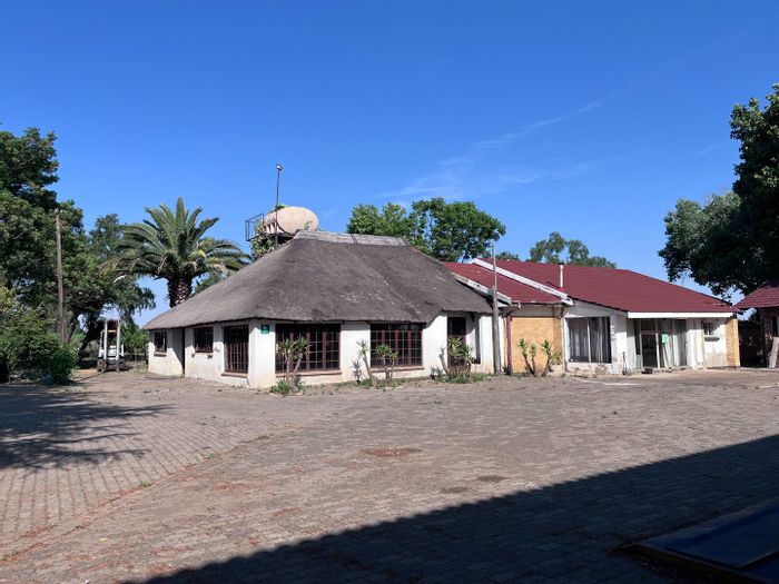 For Sale: Farm in Theoville with workshop, offices, borehole, and utilities.