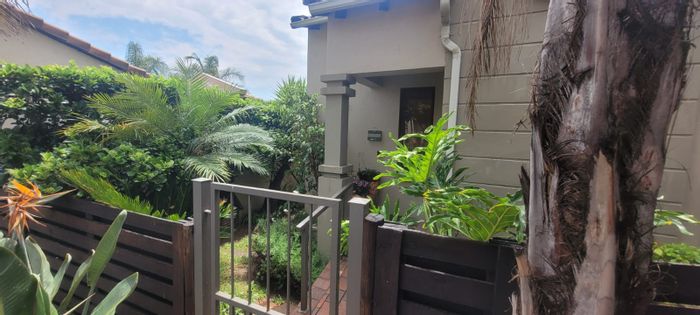 For Sale: Townhouse in Douglasdale with garden, pool access, and 24-hour security.