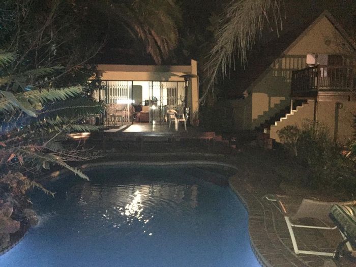 Spacious 3-bedroom house in Lombardy East with pool, cottages, and security features. For Sale.