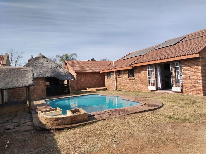 For Sale: House in Doornpoort with 4 beds, pool, lapa, and solar power.