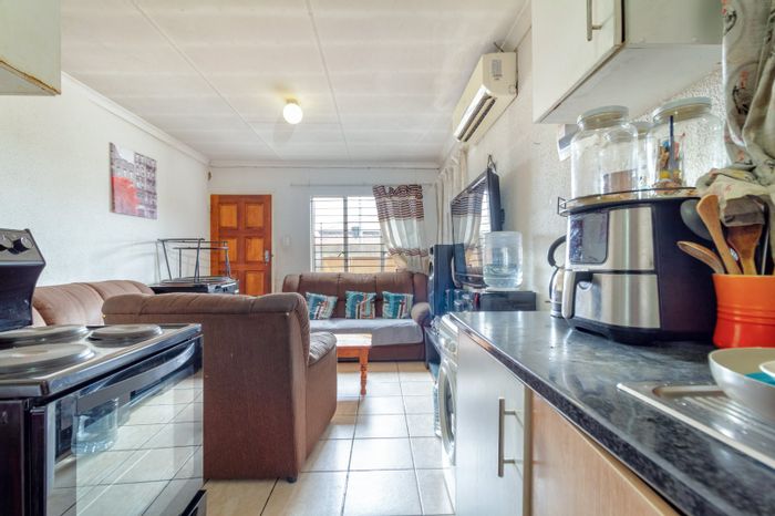 2-Bedroom House For Sale in Cosmo City with secure parking and electric fencing.