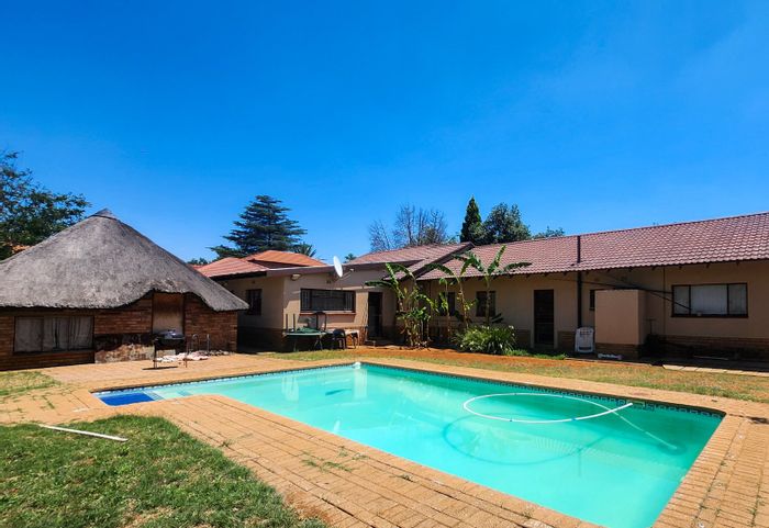 For Sale: Spacious 4-bedroom house with pool and enclosed lapa in Stilfontein Ext 4.
