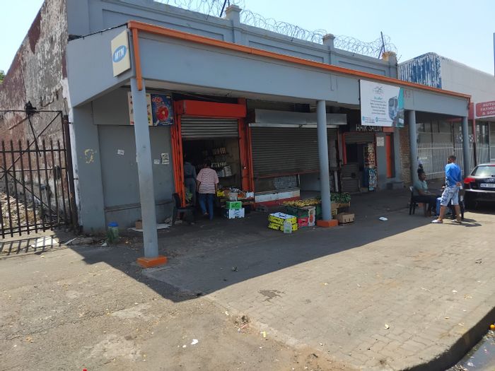 Commercial property for sale in Jeppestown: 3 shops, 5 backrooms, income potential.