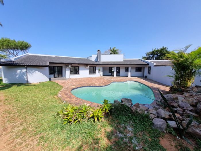 House To Rent in Umhlanga Central: 4 beds, flatlet, large garden, security features.