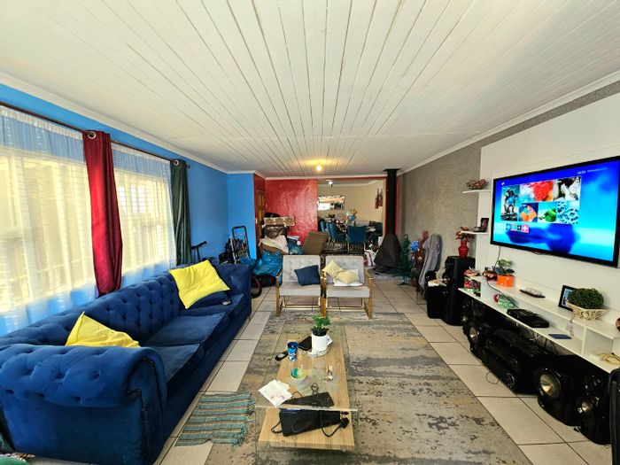 Three-bedroom house for sale in Strandfontein Village with garage and open-plan living.