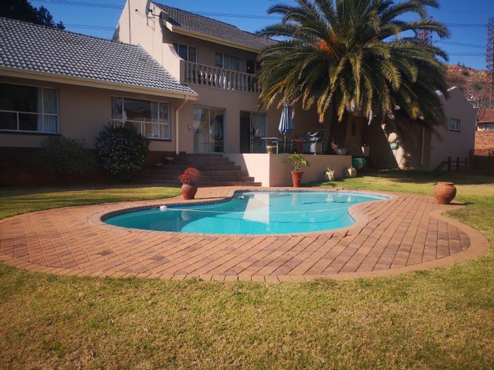 For Sale: Spacious 4-bedroom house in Sunnyrock with pool, cottage, and security.
