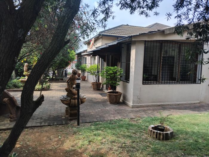 For Sale: 4-bedroom house in Primrose with pub, braai area, and staff quarters.