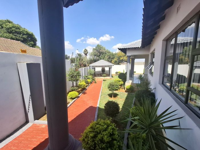 For Sale: Woodmere House with pool, cottage, security, and entertainment areas.