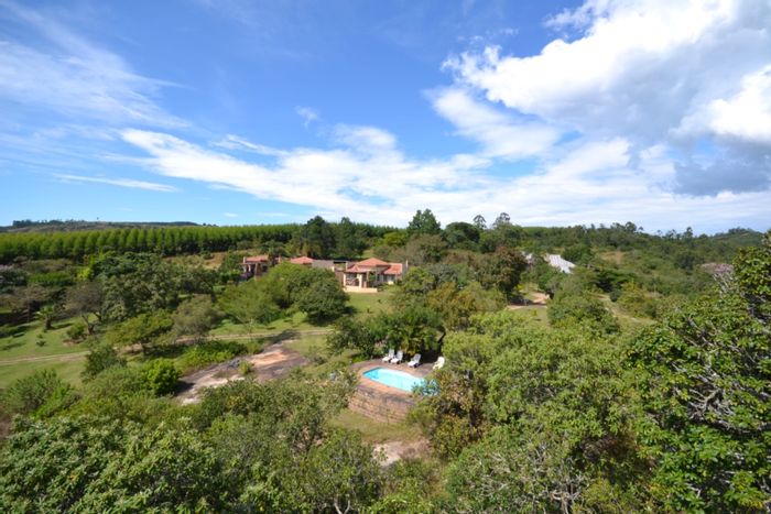 For Sale: White River Rural Farm with multiple dwellings, arable land, and water access.